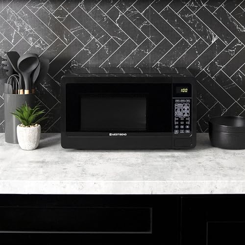 West Bend Microwave Oven 700-Watts Compact with 6 Pre-Set Cooking Settings, Speed Defrost, Electronic Control Panel and Glass Turntable, 0.7 Cu.Ft., Black