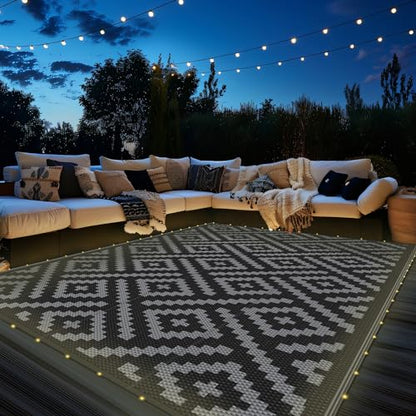 GENIMO Outdoor Rug with LED Strip Lights, 6'x9' Waterproof Camping Mat, Reversible Plastic Straw Rugs for Patio, RV, Camper, Balcony, Backyard, Picnic, Deck, Black & Gray
