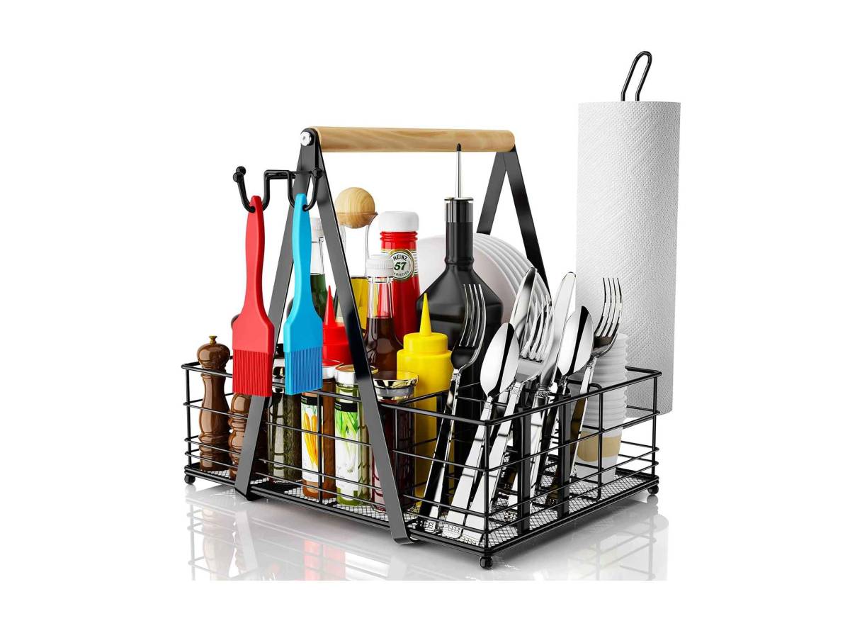 Kitchen utensil caddy with cutlery and condiments on a white background
