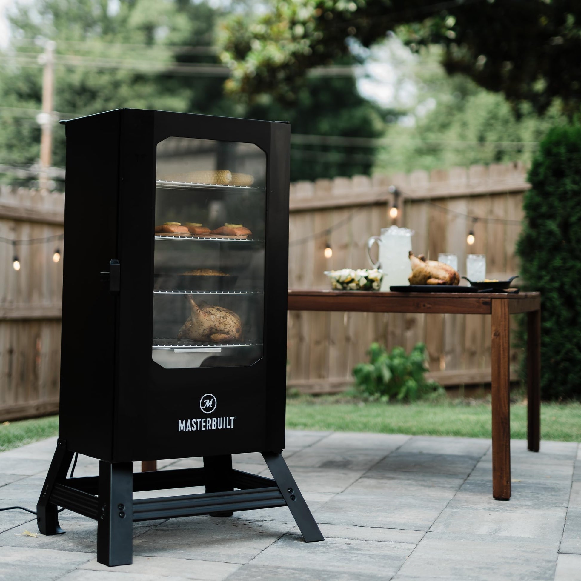 Masterbuilt® 30-inch Digital Electric Vertical BBQ Smoker with Leg Kit, Side Wood Chip Loader and 710 Cooking Square Inches in Black, Model MB20070421 - CookCave