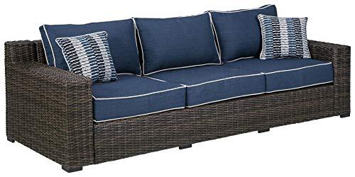 Signature Design by Ashley Grasson Lane Outdoor Patio Wicker Sofa with Cushion and 2 Pillows, Brown & Blue - CookCave