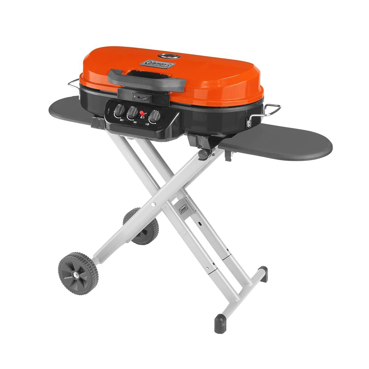 Coleman RoadTrip 285 Portable Propane Gas Grill, 20,000 BTUs, 3 Burners, Matchless Push-Button Ignition, Sturdy Quick-Fold Legs, Wheels, Orange - CookCave