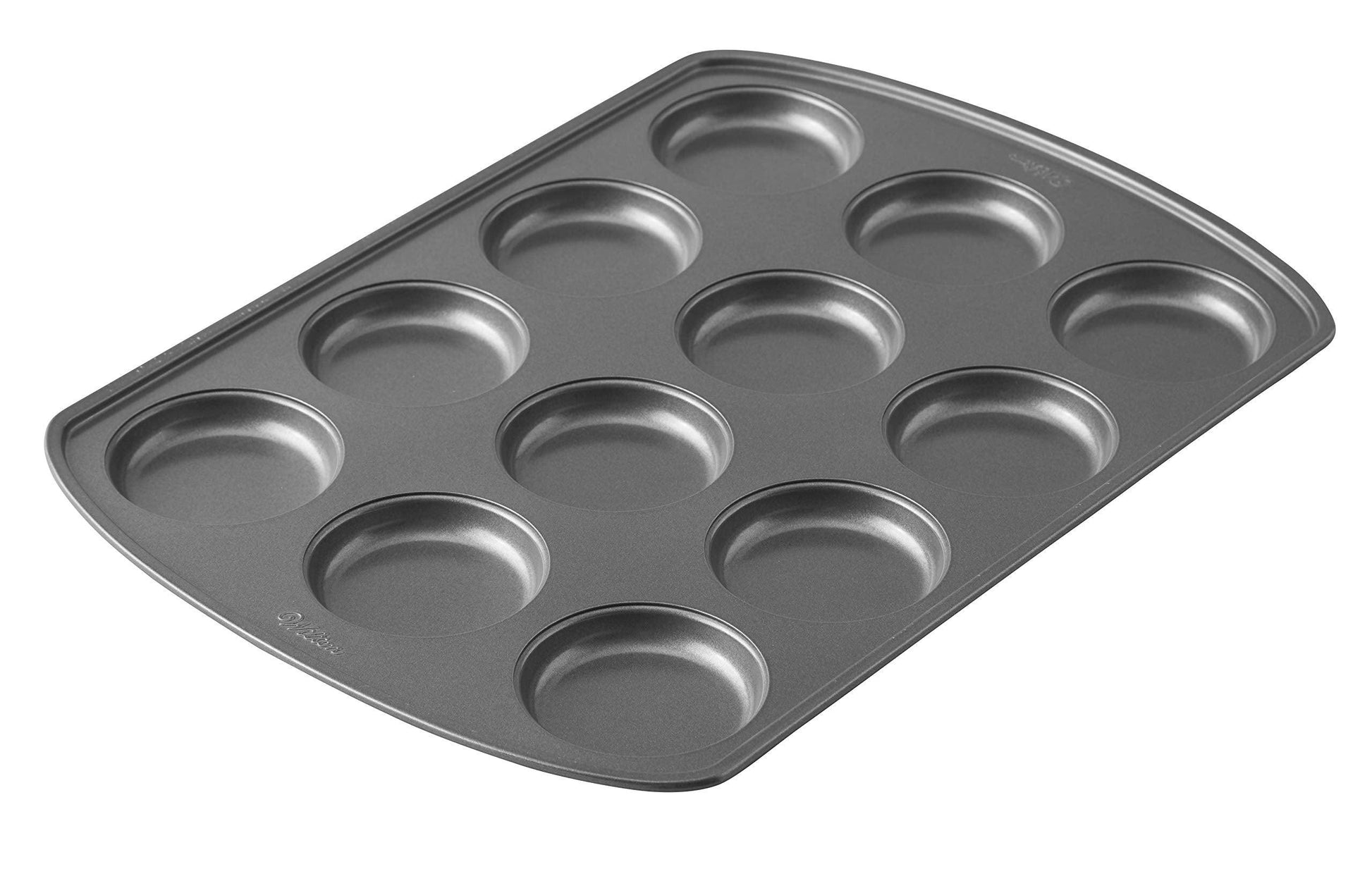 Wilton Perfect Results Premium Non-Stick Bakeware Muffin Top Pan - The Shallow Baking Cups Make Perfect Muffin Tops, Drop Cookies or Whoopie Pie Shells, 12-Cavity, Steel - CookCave