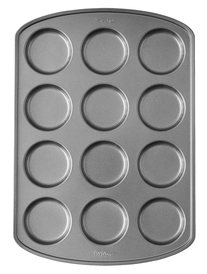 Wilton Perfect Results Premium Non-Stick Bakeware Muffin Top Pan - The Shallow Baking Cups Make Perfect Muffin Tops, Drop Cookies or Whoopie Pie Shells, 12-Cavity, Steel - CookCave